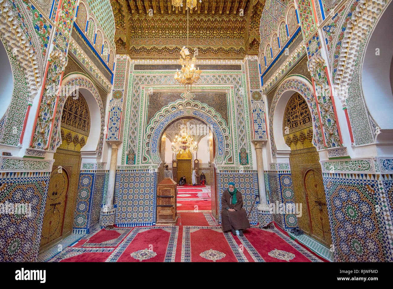Inside courtyard and interior of The Zaouia Moulay Idriss II is shrine or mosque  and is dedicated to and tomb of Moulay Idriss II in Fez. Fes Morocco Stock Photo