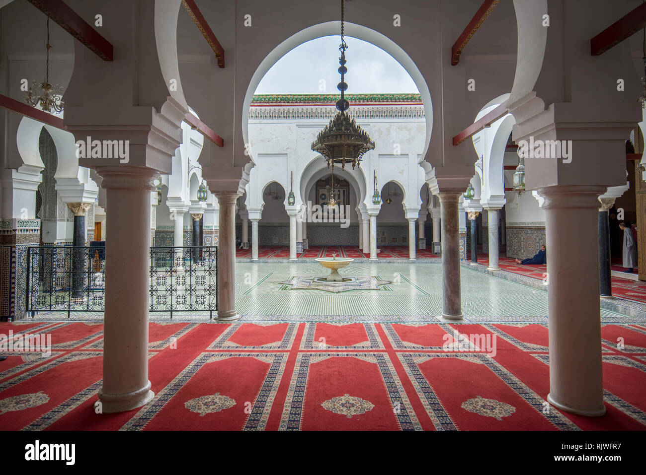 Inside courtyard and interior of The Zaouia Moulay Idriss II is shrine or mosque  and is dedicated to and tomb of Moulay Idriss II in Fez, Morocco Stock Photo