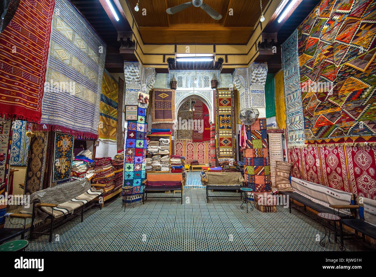 Inside interior of Carpet shop with colourful moroccan rugs and berber
