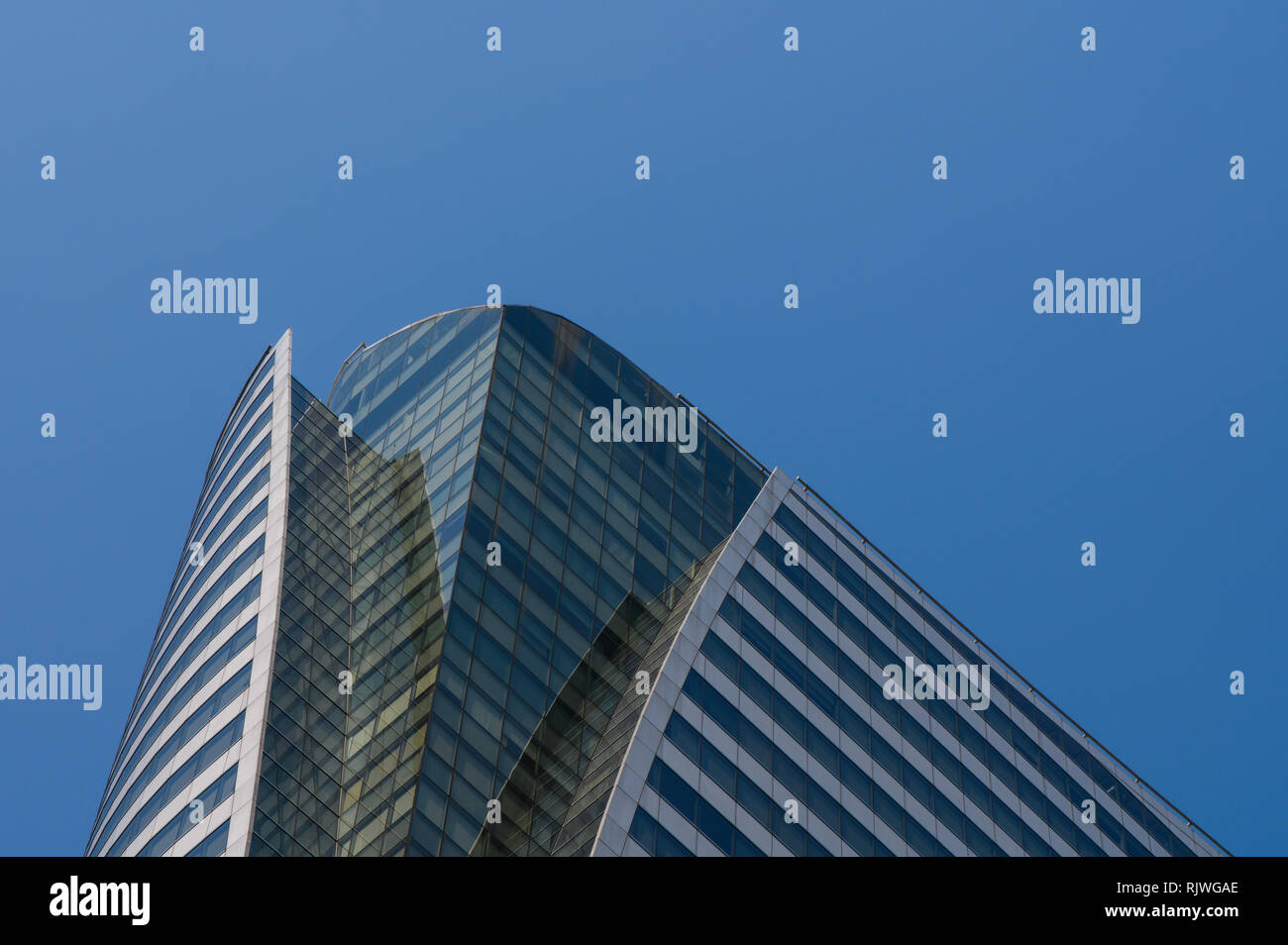 High rise buildings and blue sky Stock Photo - Alamy