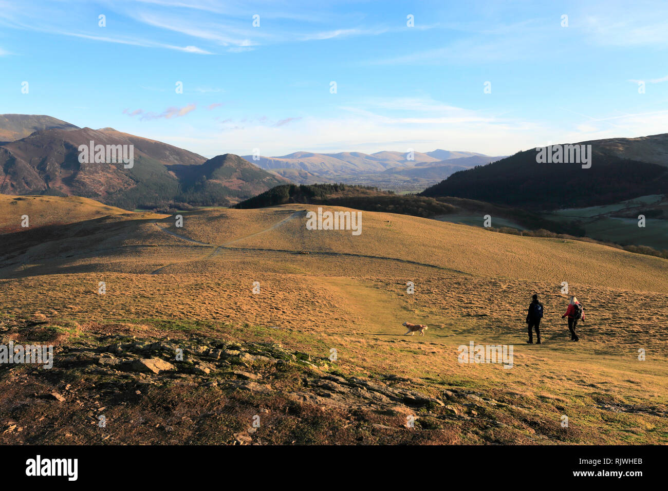 Walkers at the summit Cairn of Sale Fell, Wythop Moss, Lake District National Park, Cumbria, England, UK Sale Fell is one of the 214 Wainwright Fells. Stock Photo