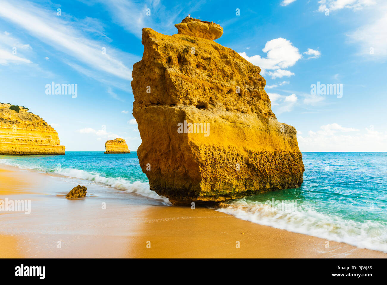 Sandstone sea stack in sunlight, Praia da Marinha, Algarve, Portugal, Europe Stock Photo