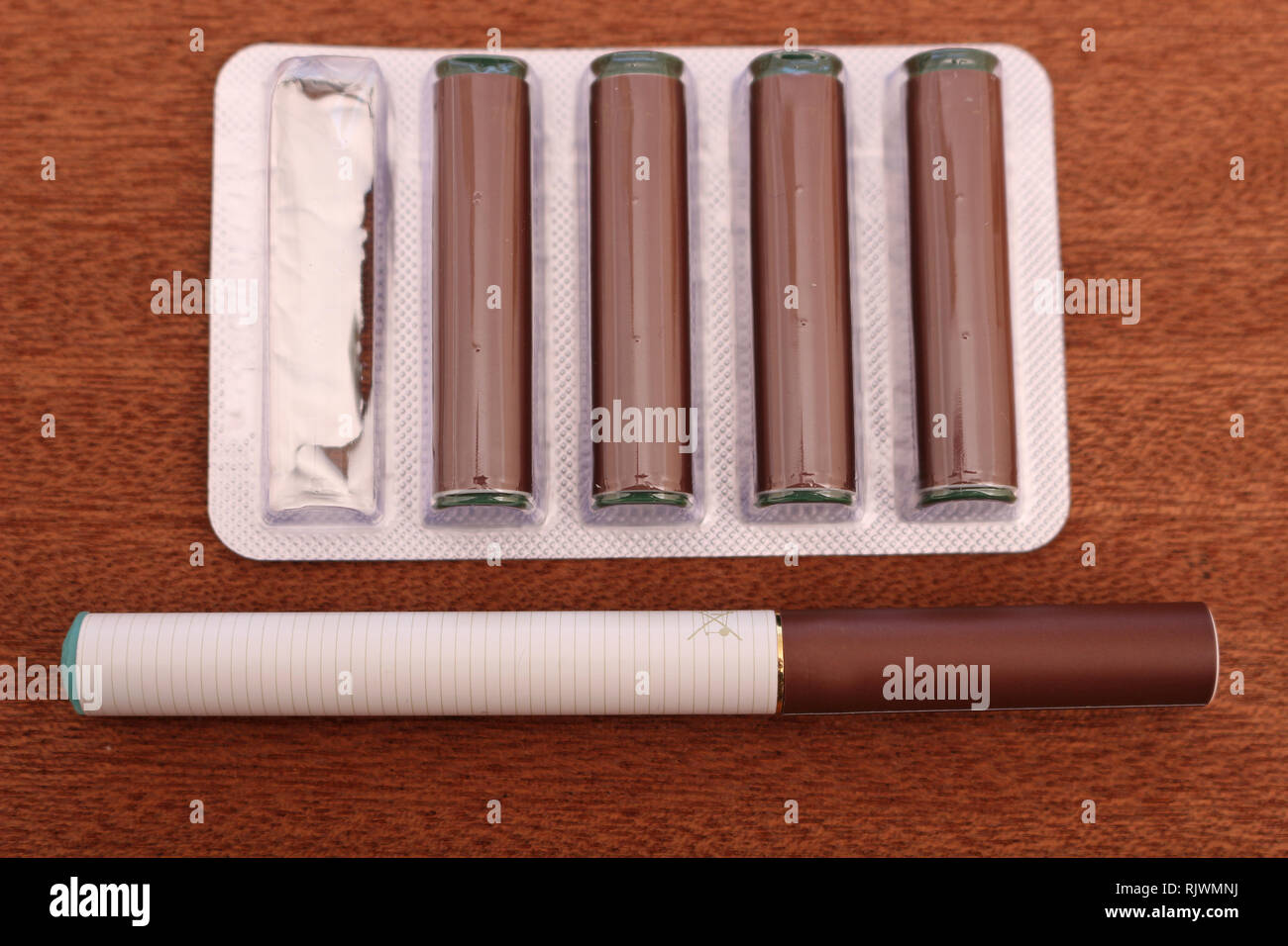 Electronic Cigarette and Cartridges Stock Photo