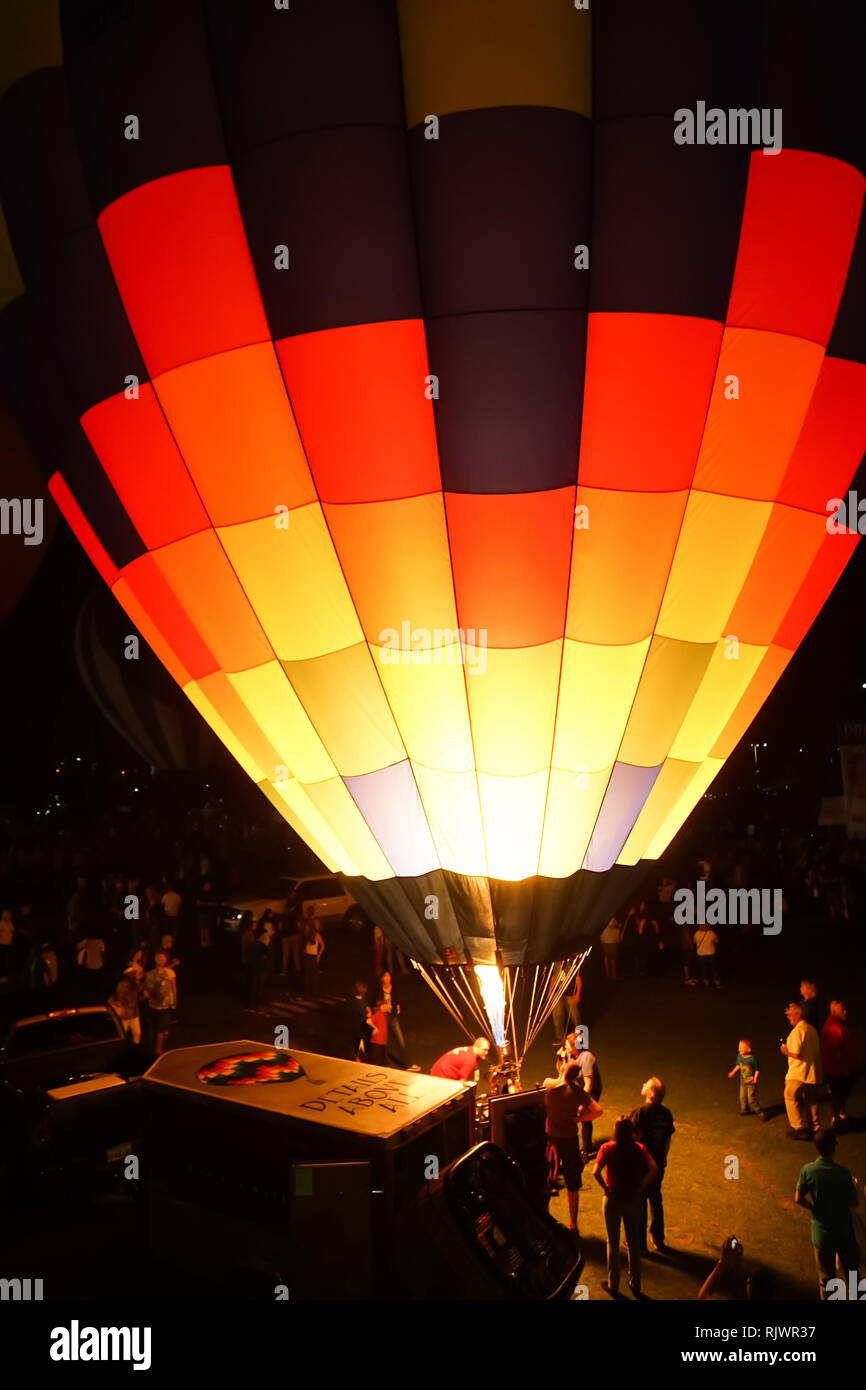Hot air balloons participate in a night glow, where pilots light up the ...