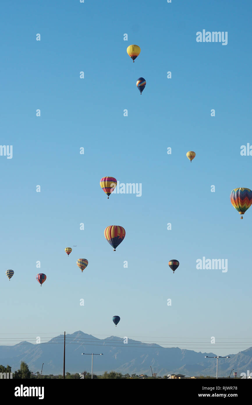 Hot air balloons rise in the sky in Phoenix, Arizona. Stock Photo