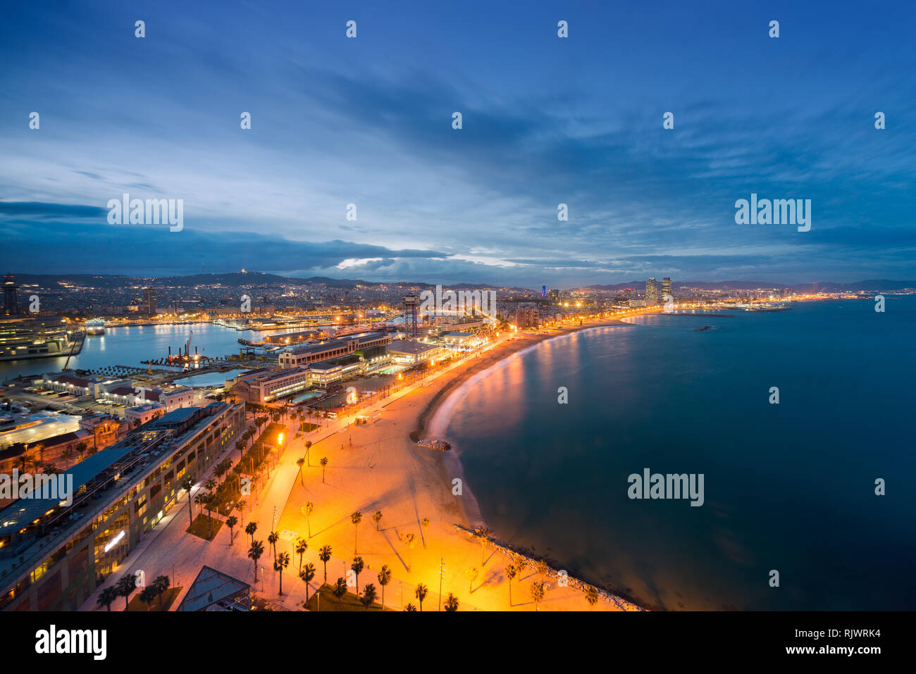 Aerial view of Barcelona Beach in summer night along seaside in Barcelona, Spain. Mediterranean