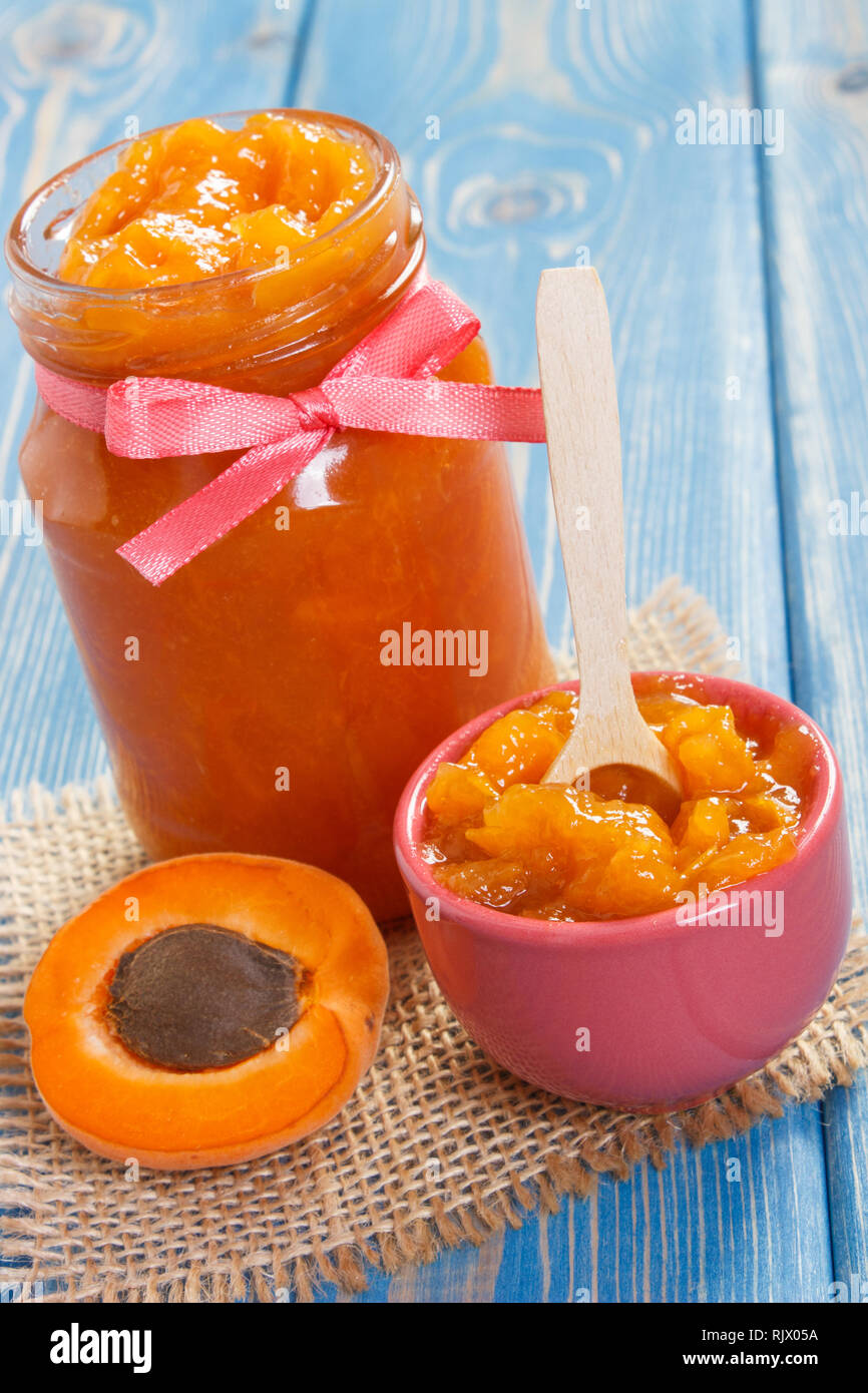 Fresh homemade apricot marmalade and ripe fruits, concept of healthy sweet dessert Stock Photo
