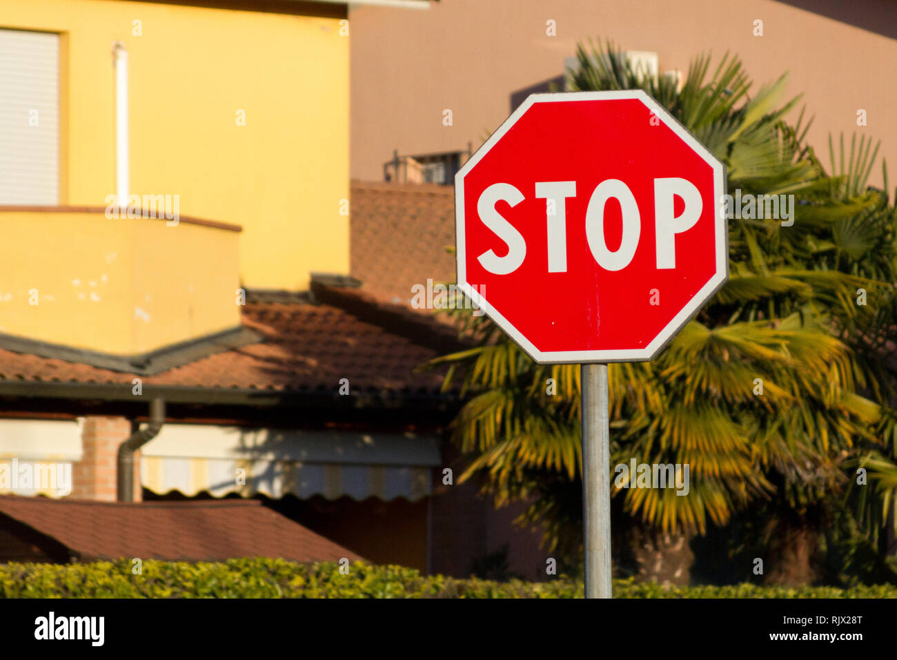 A stop sign in a street Stock Photo