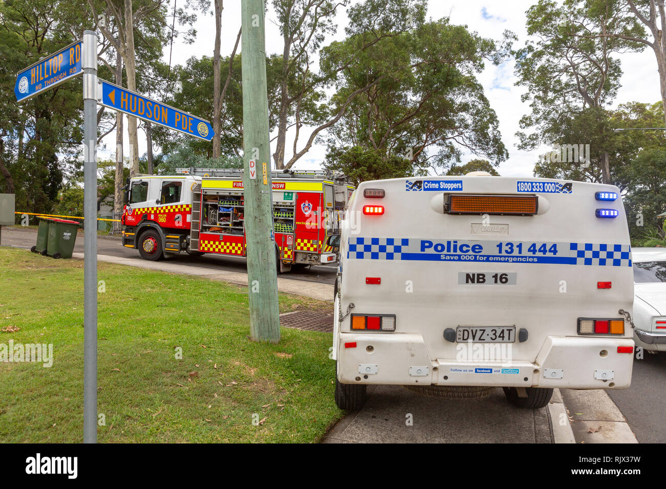 New South Wales fire and rescue truck and nsw police car attend to a fallen tree on Sydney northern beaches,Australia Stock Photo
