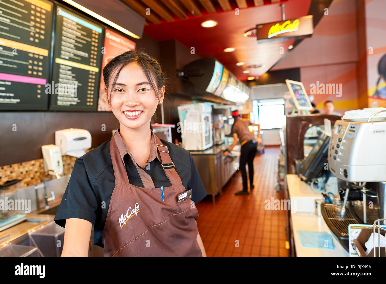 Mccafe Worker PATTAYA, THAILAND - FEBRUARY 21, 2016: worker at McCafe in Thailand ...