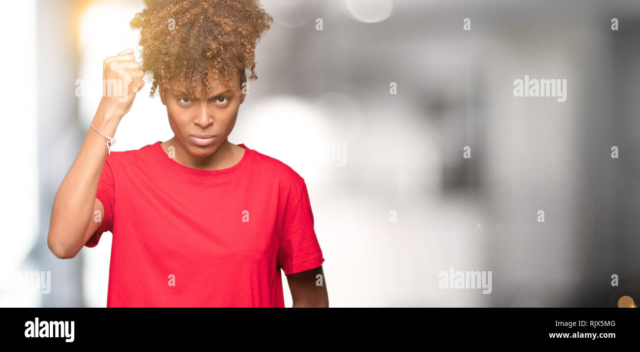 Angry young woman raising hand hi-res stock photography and images - Alamy