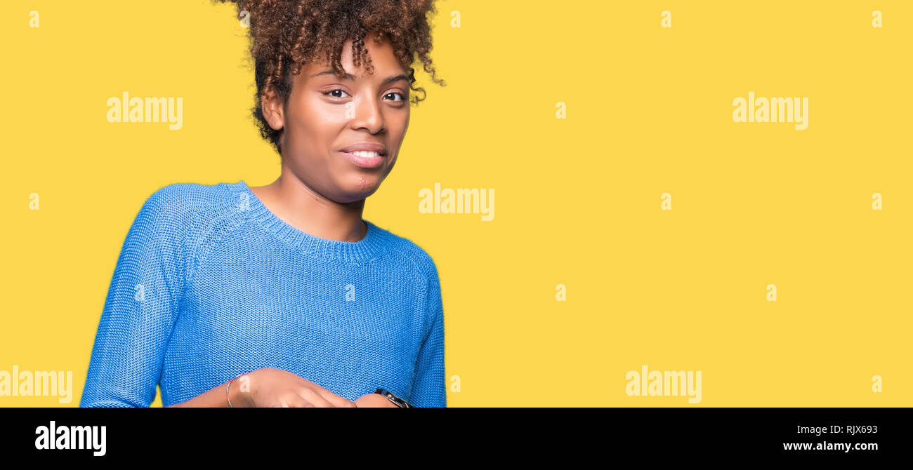 Beautiful young african american woman over isolated background ...