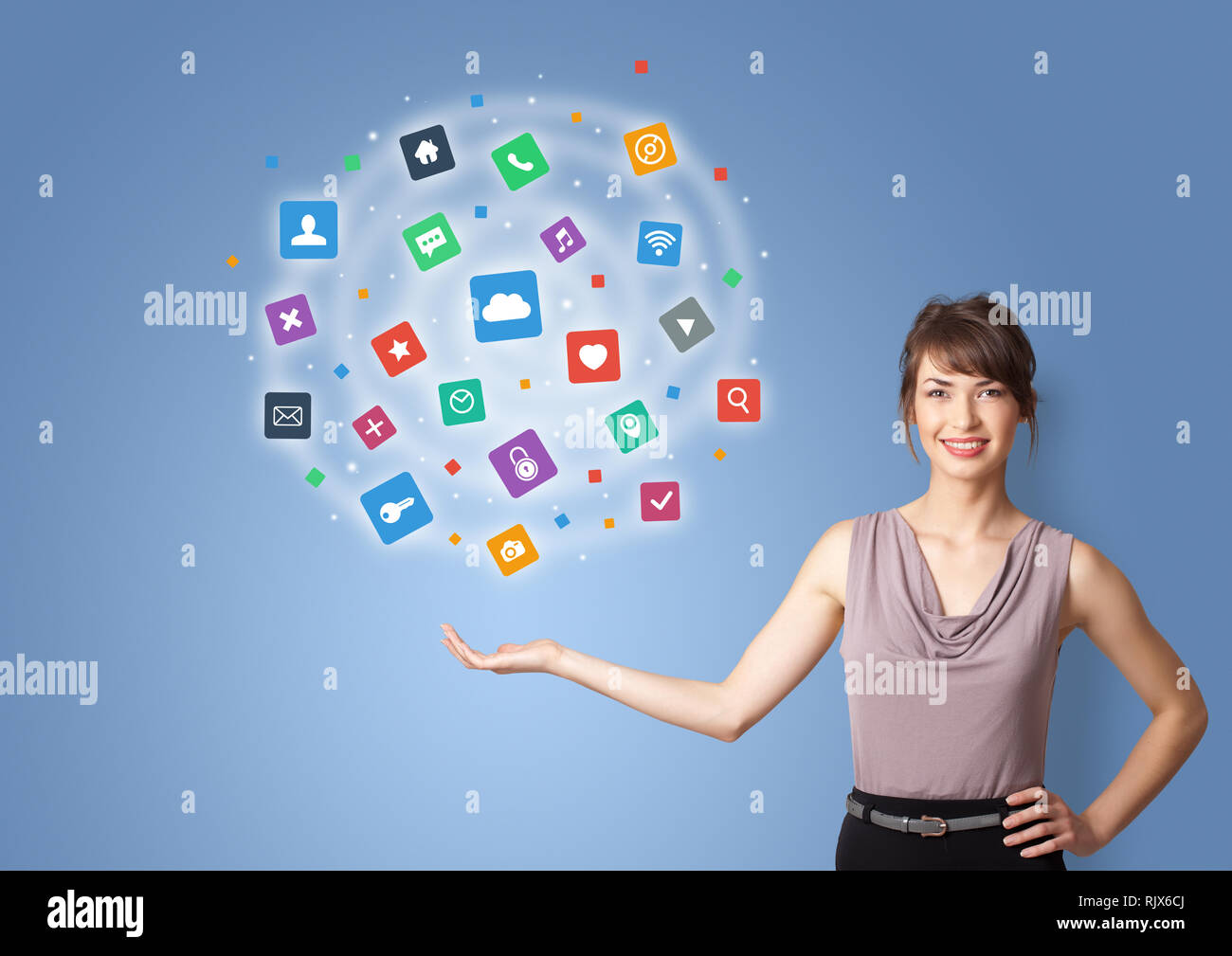 Young person presenting new application icons and symbols Stock Photo ...