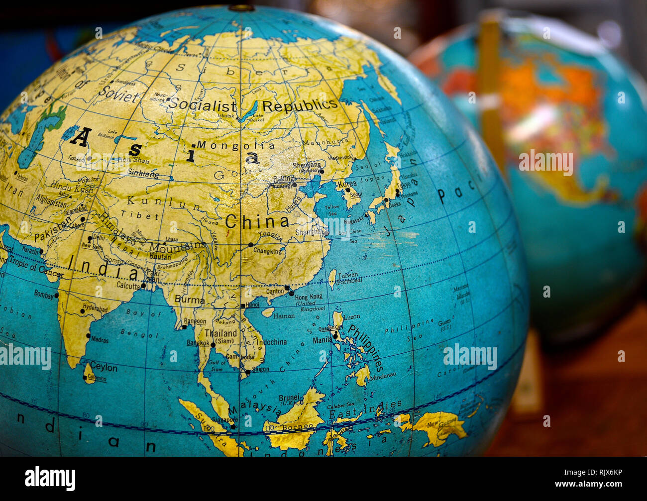Vintage world globe featuring Asia, China and India for sale at an antique  shop Stock Photo - Alamy