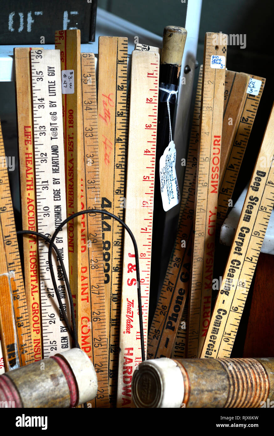 Vintage yardsticks for sale at an antique shop Stock Photo Alamy