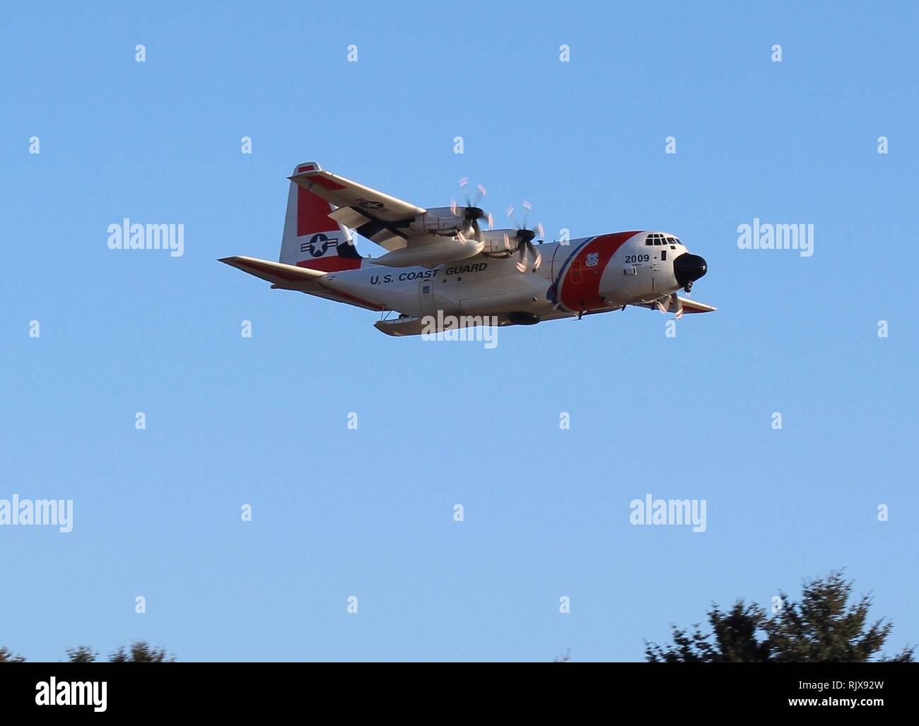 A Coast Guard Air Station Kodiak HC-130 Hercules aircrew performs drop training in Kodiak, Alaska, Feb. 7, 2019. Aircrews routinely conduct training flights to remain proficient for search and rescue cases. Courtesy photo by Annie Bowers. Stock Photo