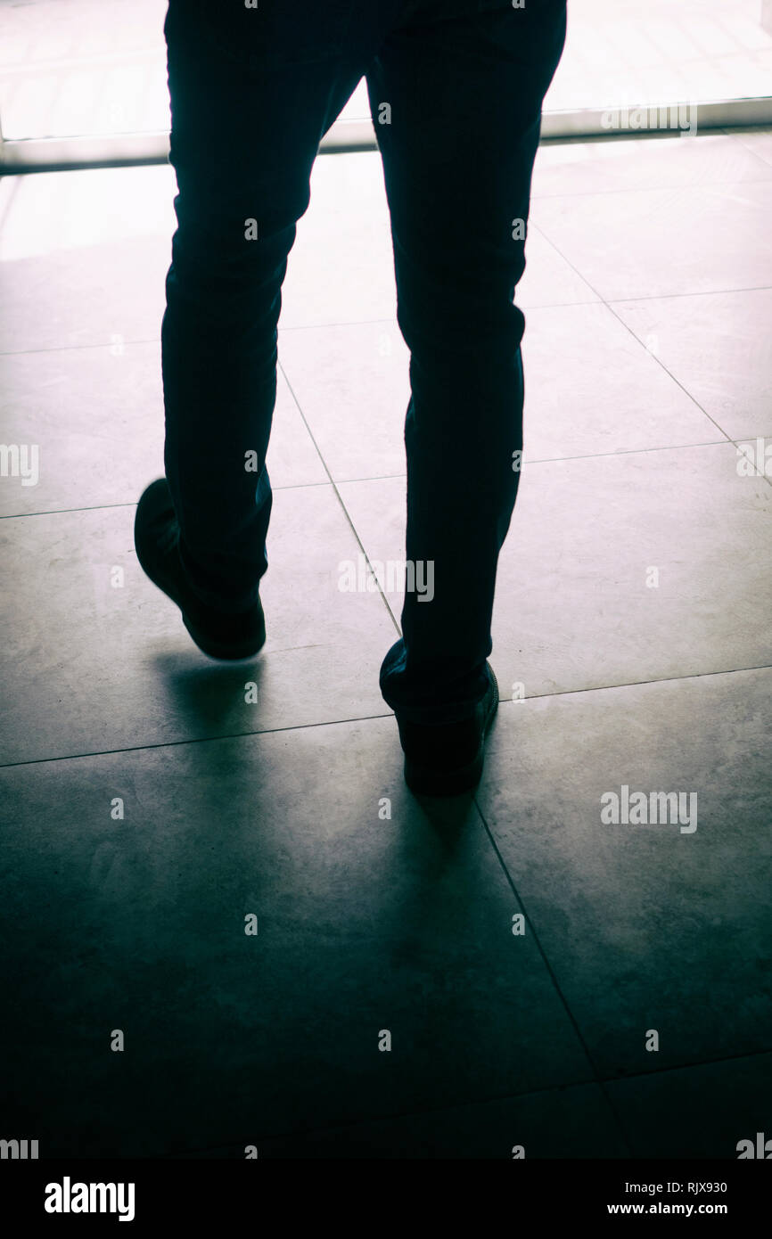 Silhouette of a man walking away hires stock photography and images