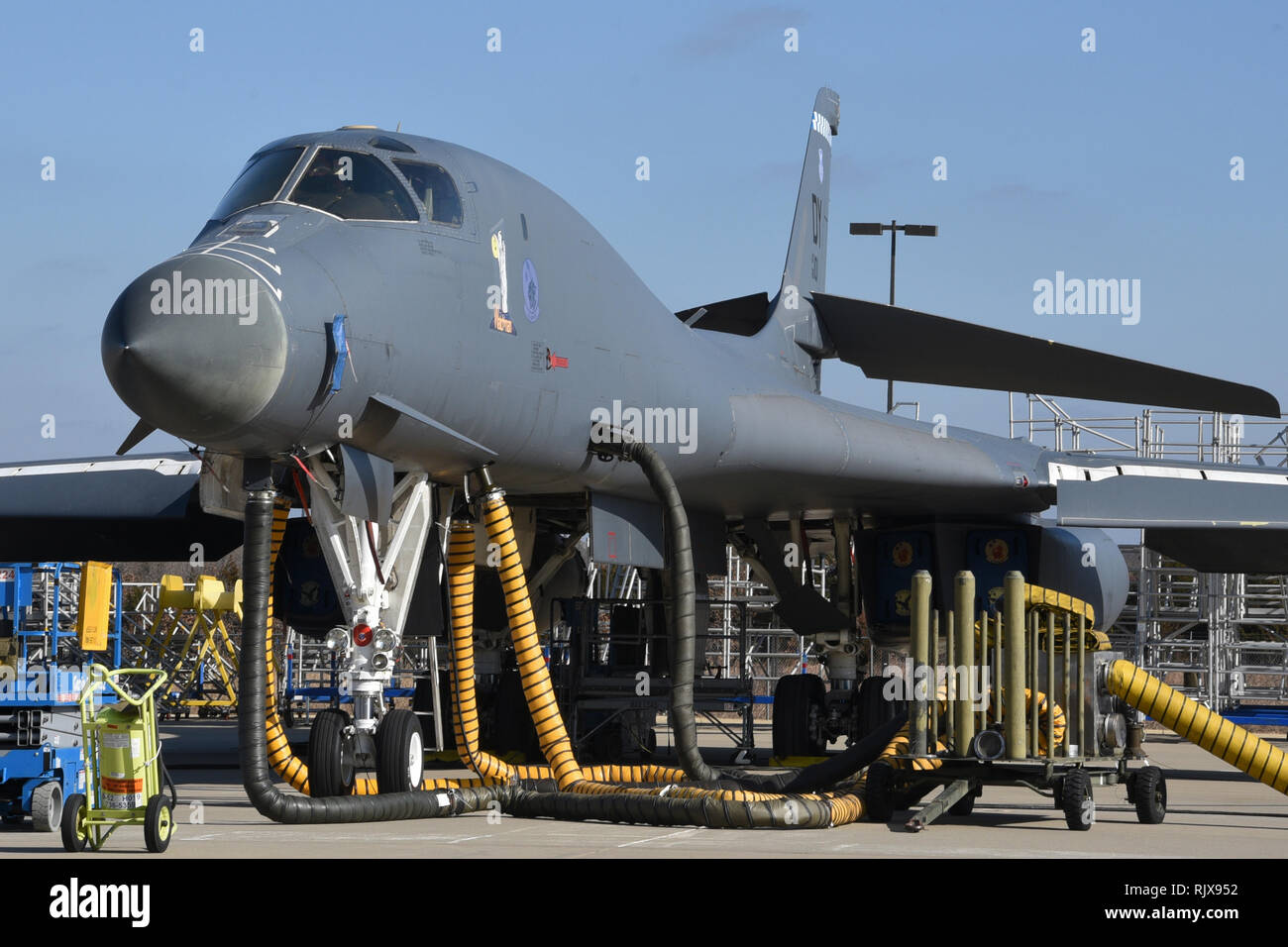 Boeing B-1B Lancer, serial # 86-0101, wearing 'Watchman' nose-art shown at the Maintenance, Repair and Overhaul Training Center with support equipment and hoses going to the aircraft as maintenance is conducted Jan. 17, 2019, Tinker Air Force Base, Oklahoma. MROTC is a facility used for heavy aircraft maintenance in a public/private partnership between the Air Force and Boeing. (U.S. Air Force photo/Greg L. Davis) Stock Photo