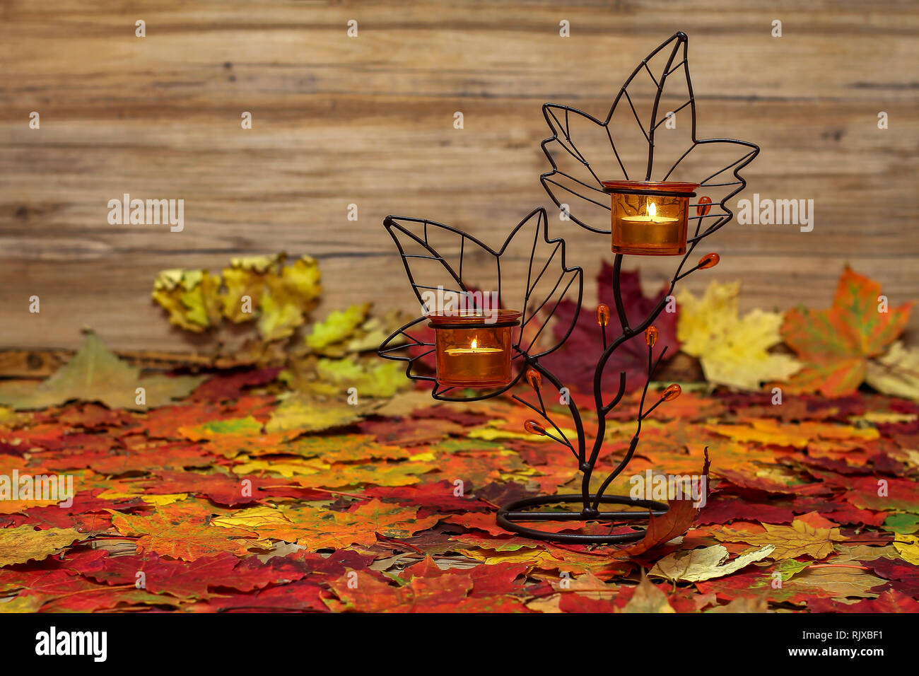 Autumn Still Life / Candlestick and autumn leaves Stock Photo Alamy