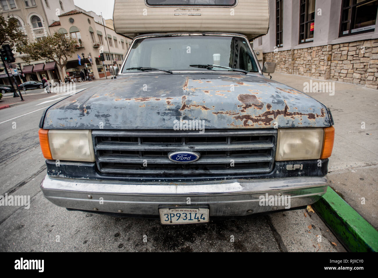 Beat up Ford vehicle. Stock Photo