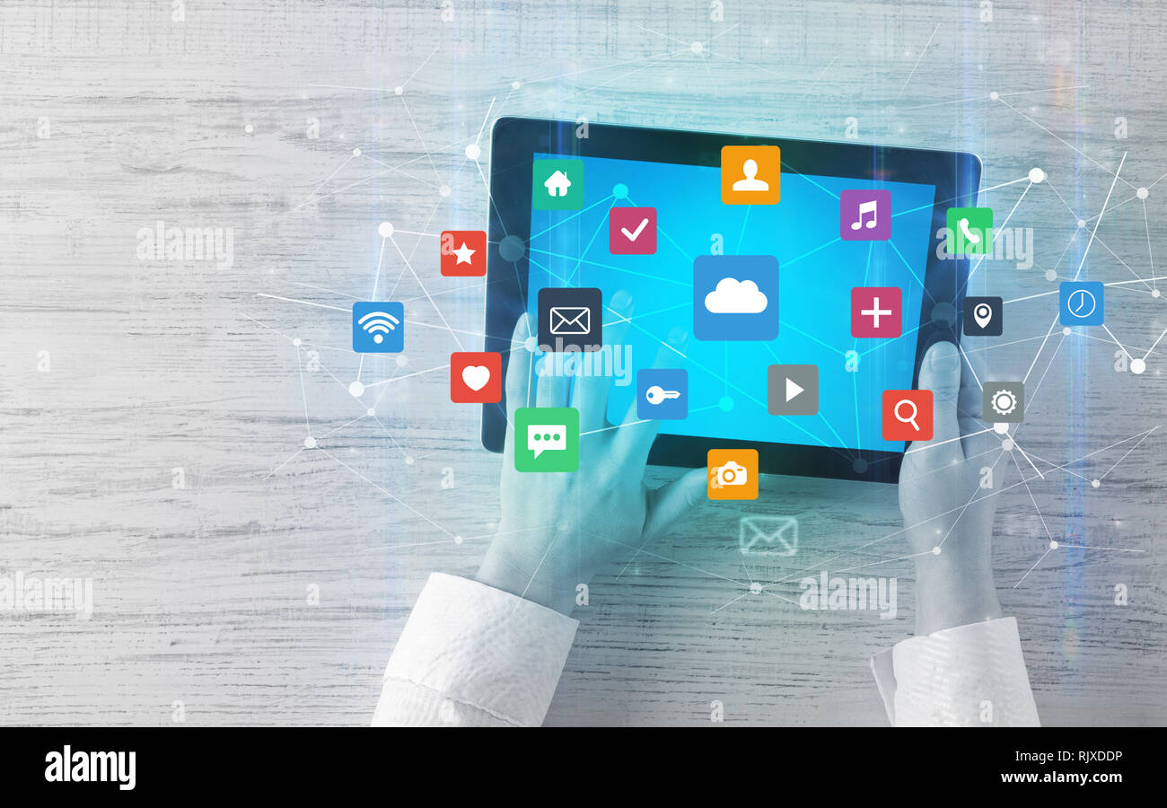 Hand touching multitask tablet with cloud wifi message social media ...