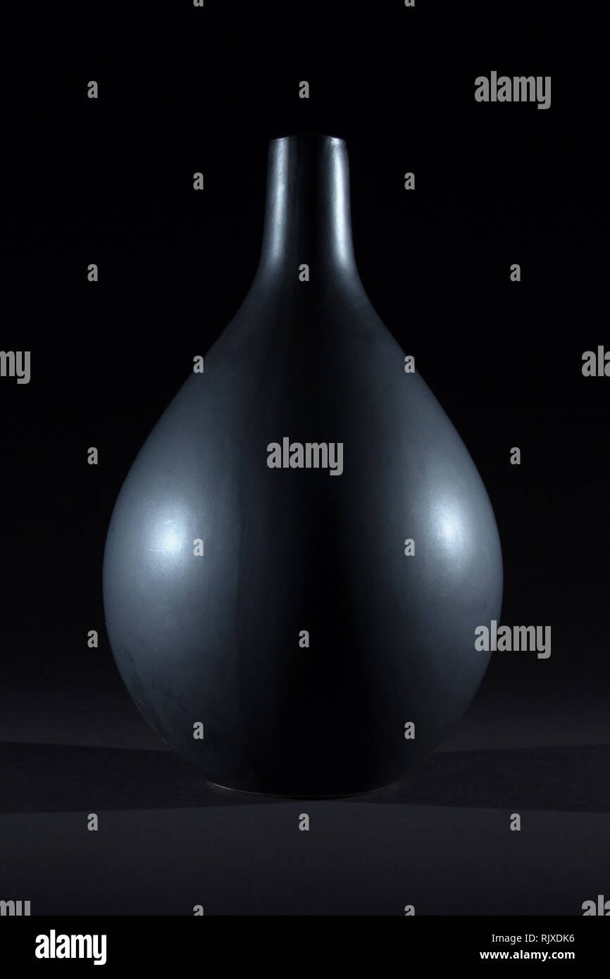 Matte black ceramic vase on black background isolated Stock Photo