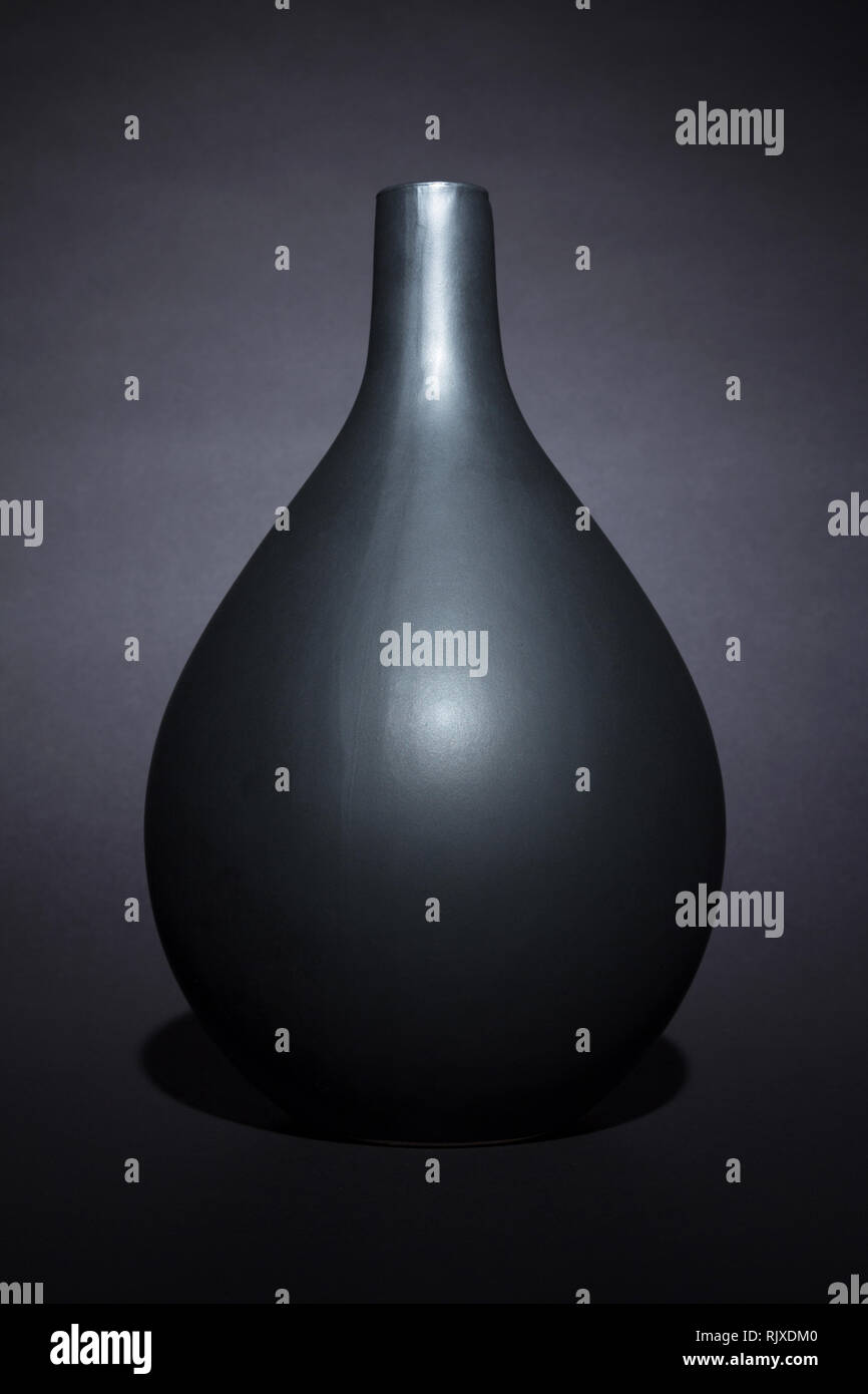 Matte black ceramic vase on black background isolated Stock Photo