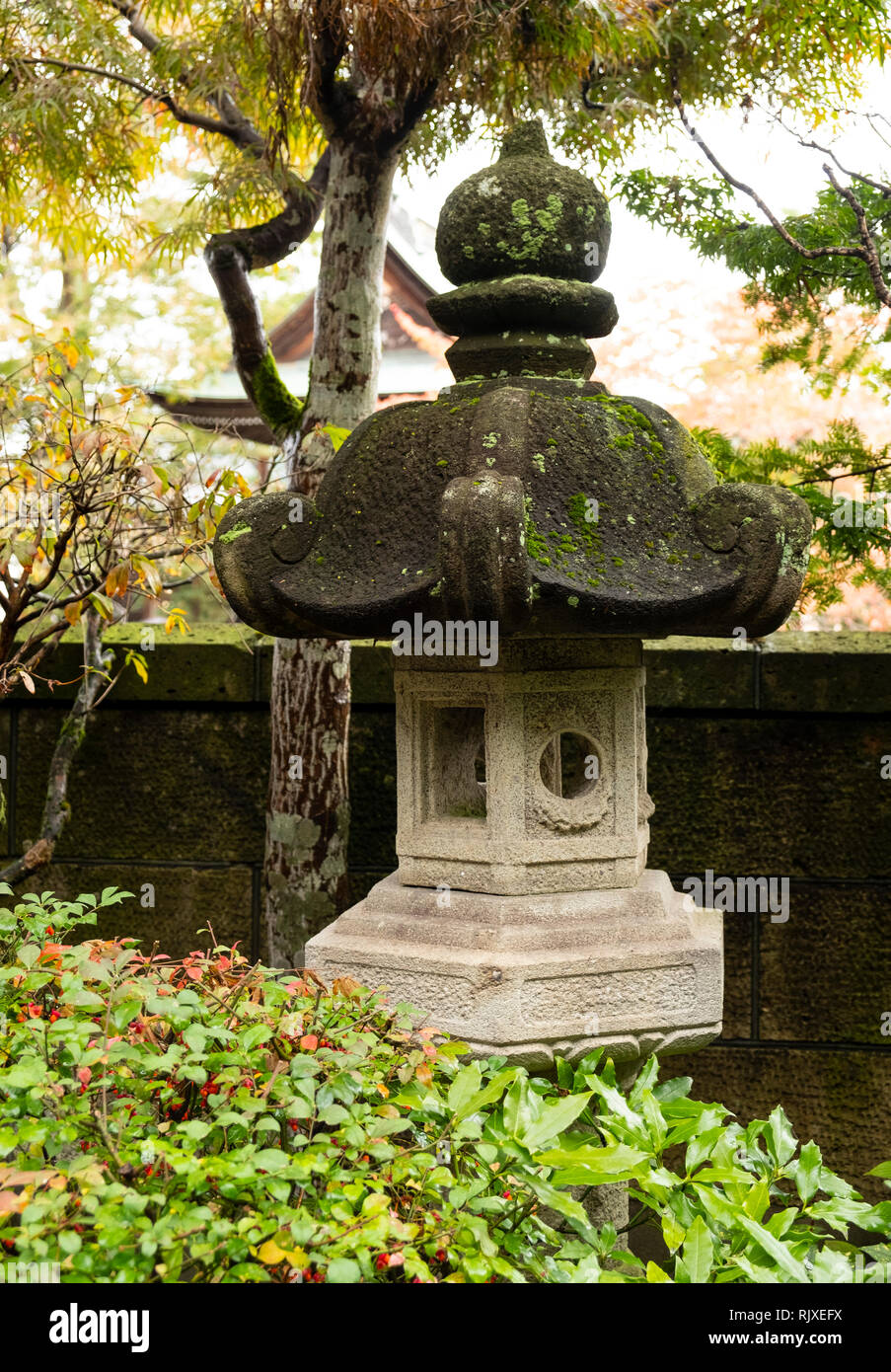 A stone lantern in the garden at the Yatsuskan ryokan in Hida Furukawa, Gifu Prefecture, Honshu,  Japan Stock Photo