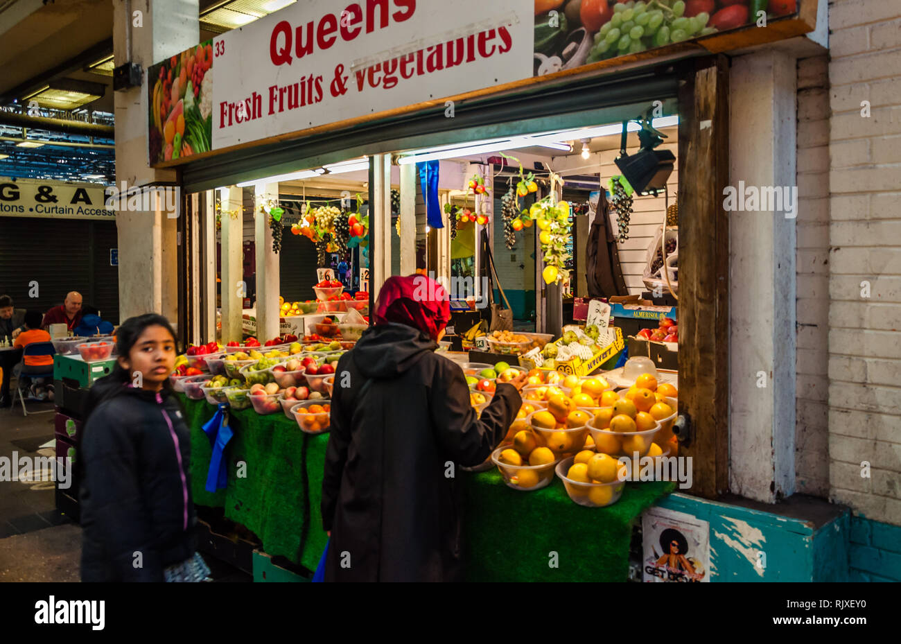 Green Street, Queens Market shops in Upton Park East London UK Stock