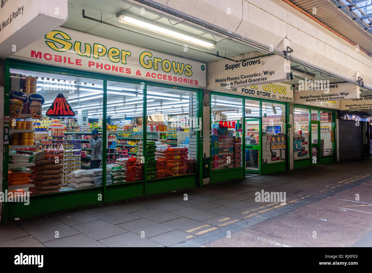 Green Street, Queens Market shops in Upton Park East London UK Stock