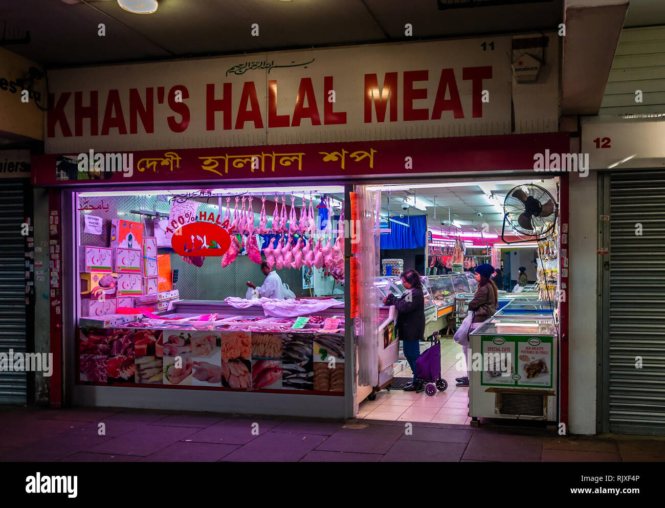 Green Street, Queens Market shops in Upton Park East London UK Stock