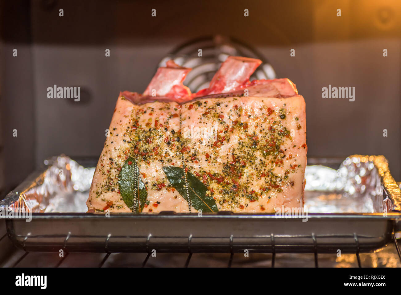 closeup view raw beef cross rib chunk on oven tray with foil inside