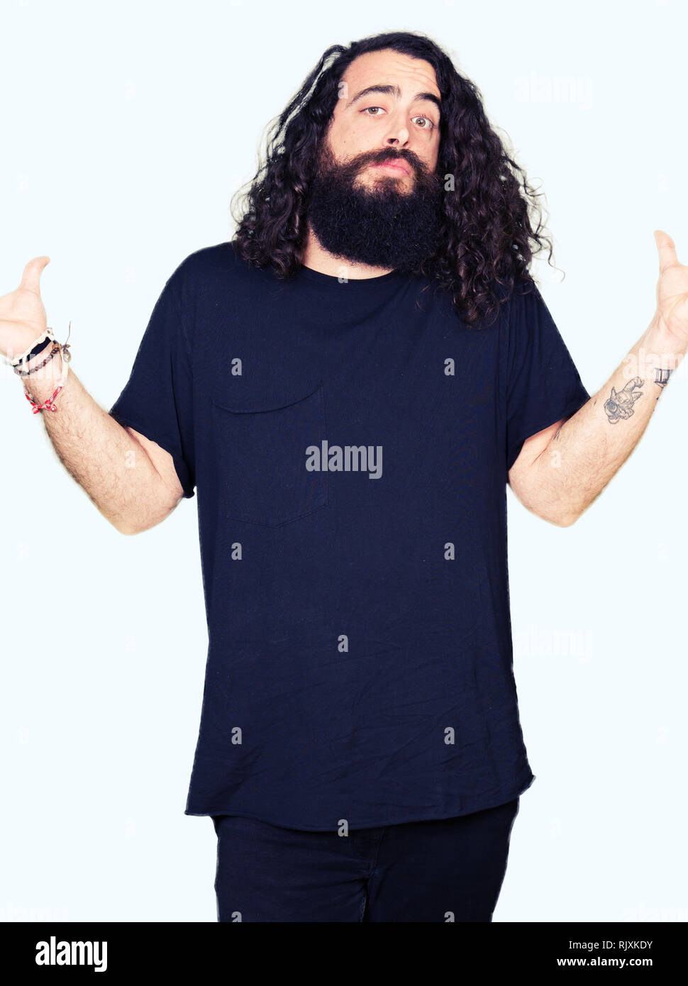 Young Man With Long Hair And Beard Wearing Heavy Metal Black