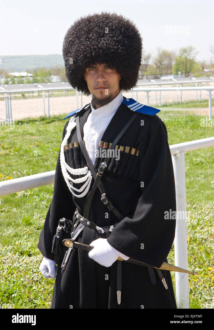 A portrait of a young man in a russian cossack uniform in Pyatigorsk,Caucasus. Stock Photo