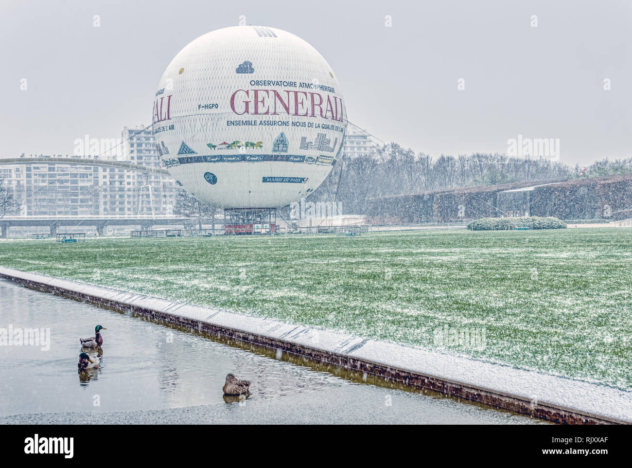Snowfall on Balloon in Parc Andre Citroen - Paris, France Stock Photo