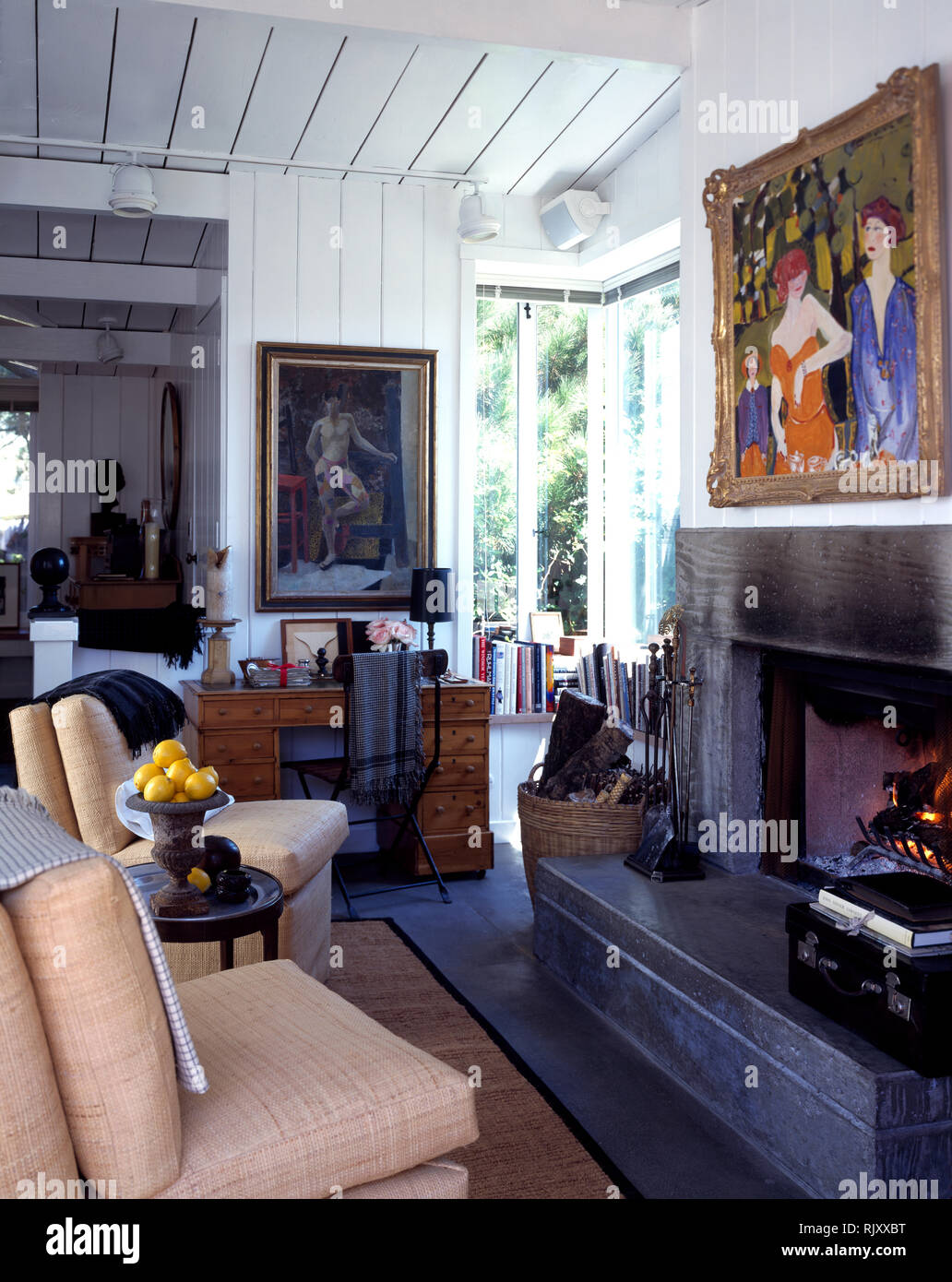 Cream chairs beside large fireplace Stock Photo Alamy