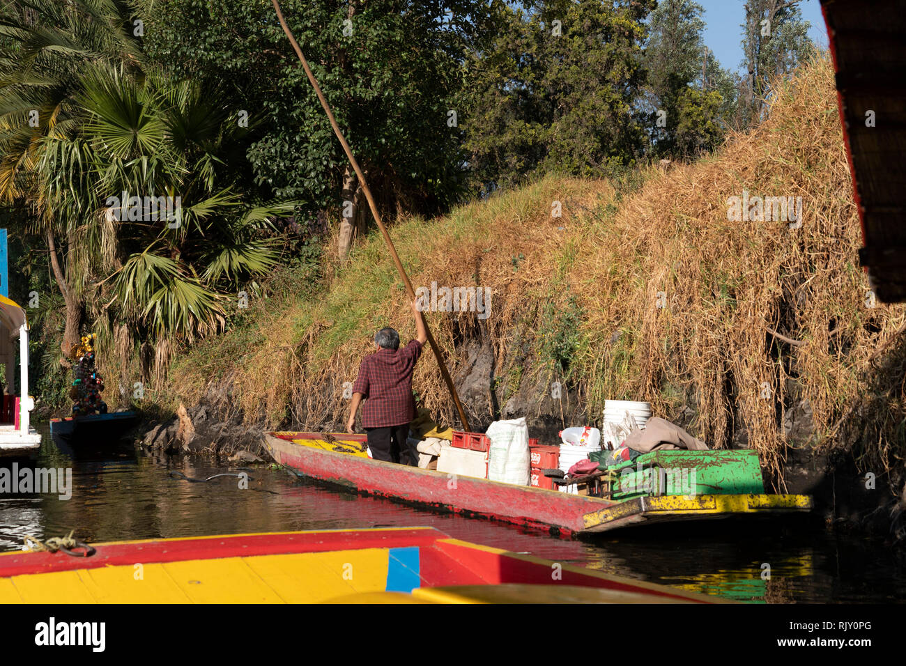 MEXICO CITY, MEXICO - JANUARY 30 2019 - Xochimilco the mexican little venice attract tourists and other city residents to ride on colorful gondola-lik Stock Photo