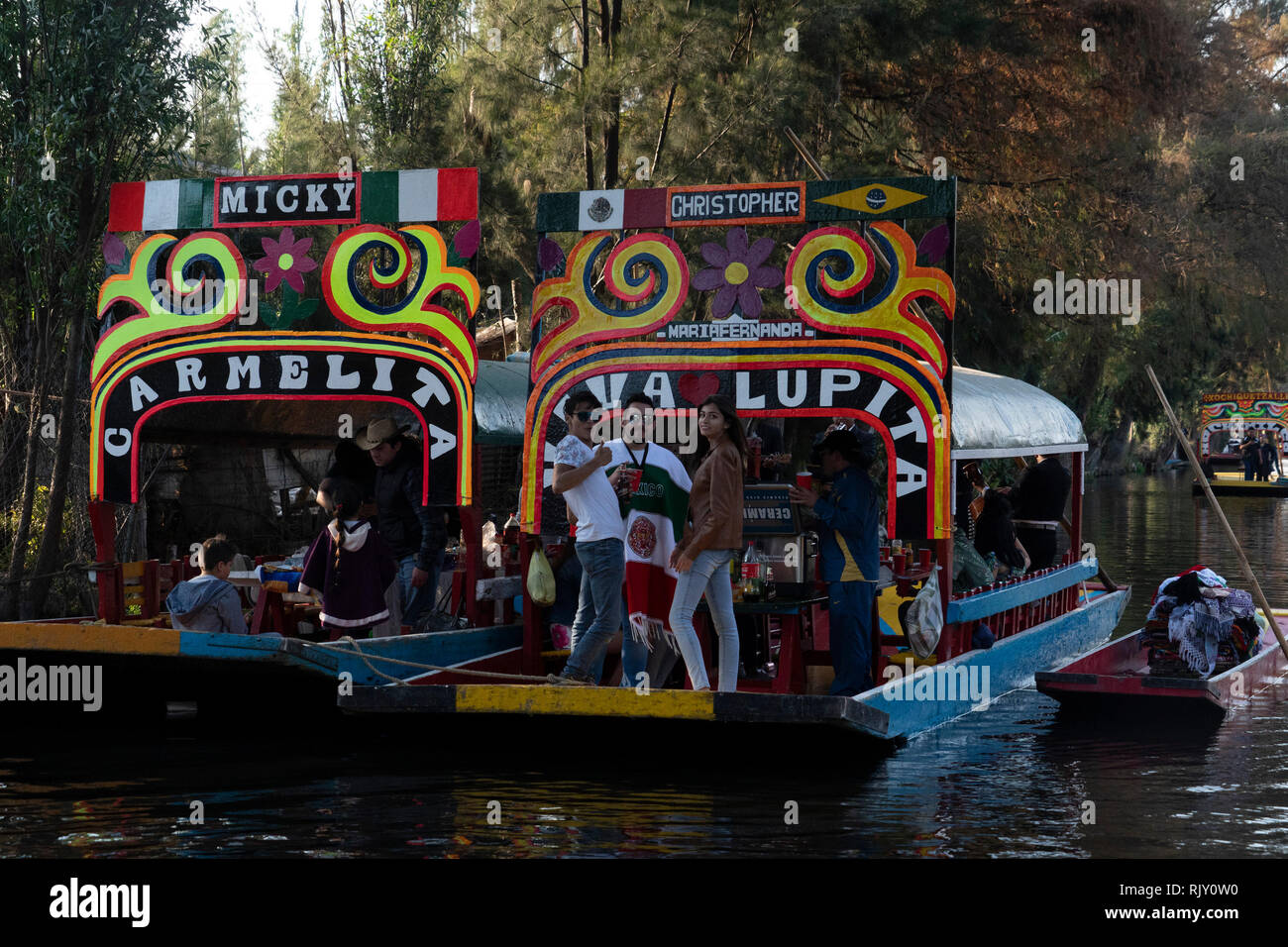 MEXICO CITY, MEXICO - JANUARY 30 2019 - Xochimilco the mexican little venice attract tourists and other city residents to ride on colorful gondola-lik Stock Photo