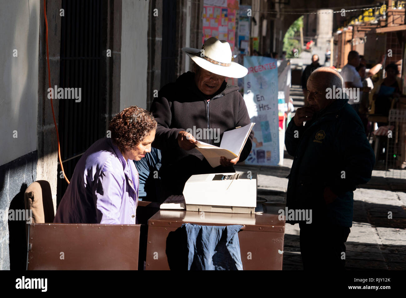 MEXICO CITY, MEXICO - JANUARY 30 2019 - Santo Domingo Place. Scribes with typewriters and antique printing machines work in this Portal offering their Stock Photo