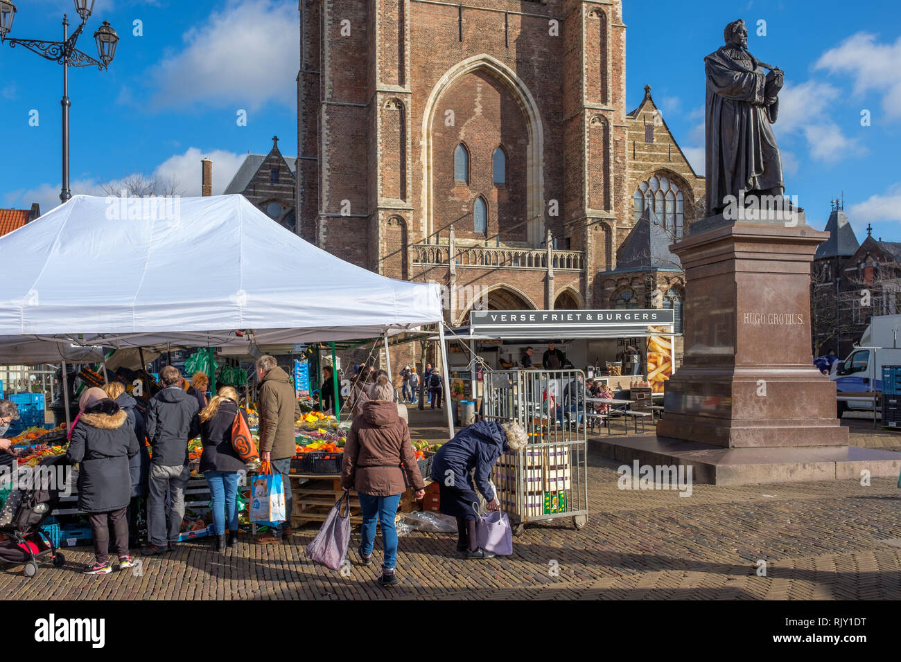 People shopping on the market at the Market square in the center of Delft, Netherlands Stock