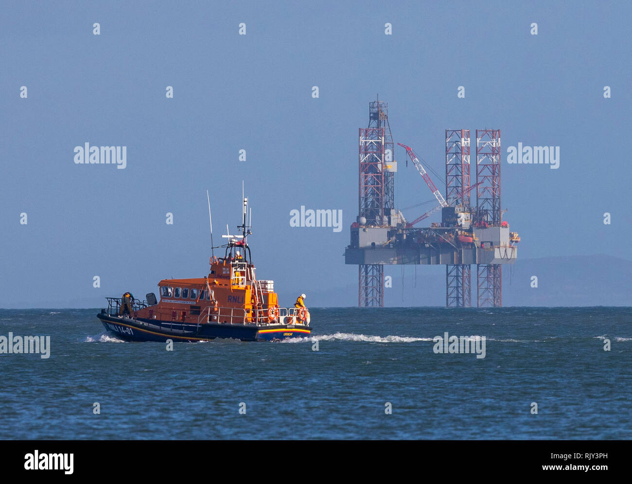 A Lifeboat Passes The Ensco 72 Drilling Rig In Poole Bay