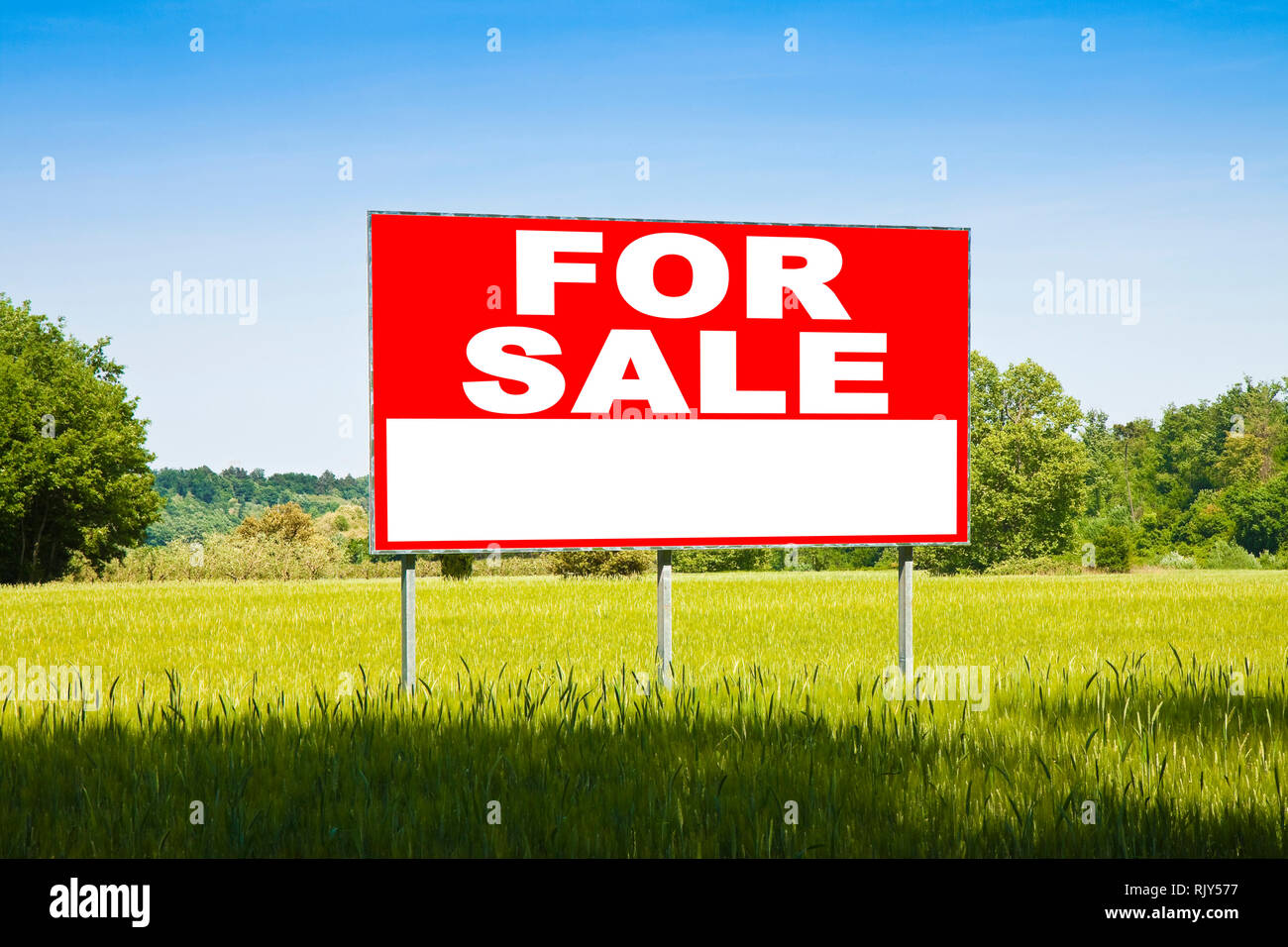 Advertising billboard immersed in a rural scene with FOR SALE written ...