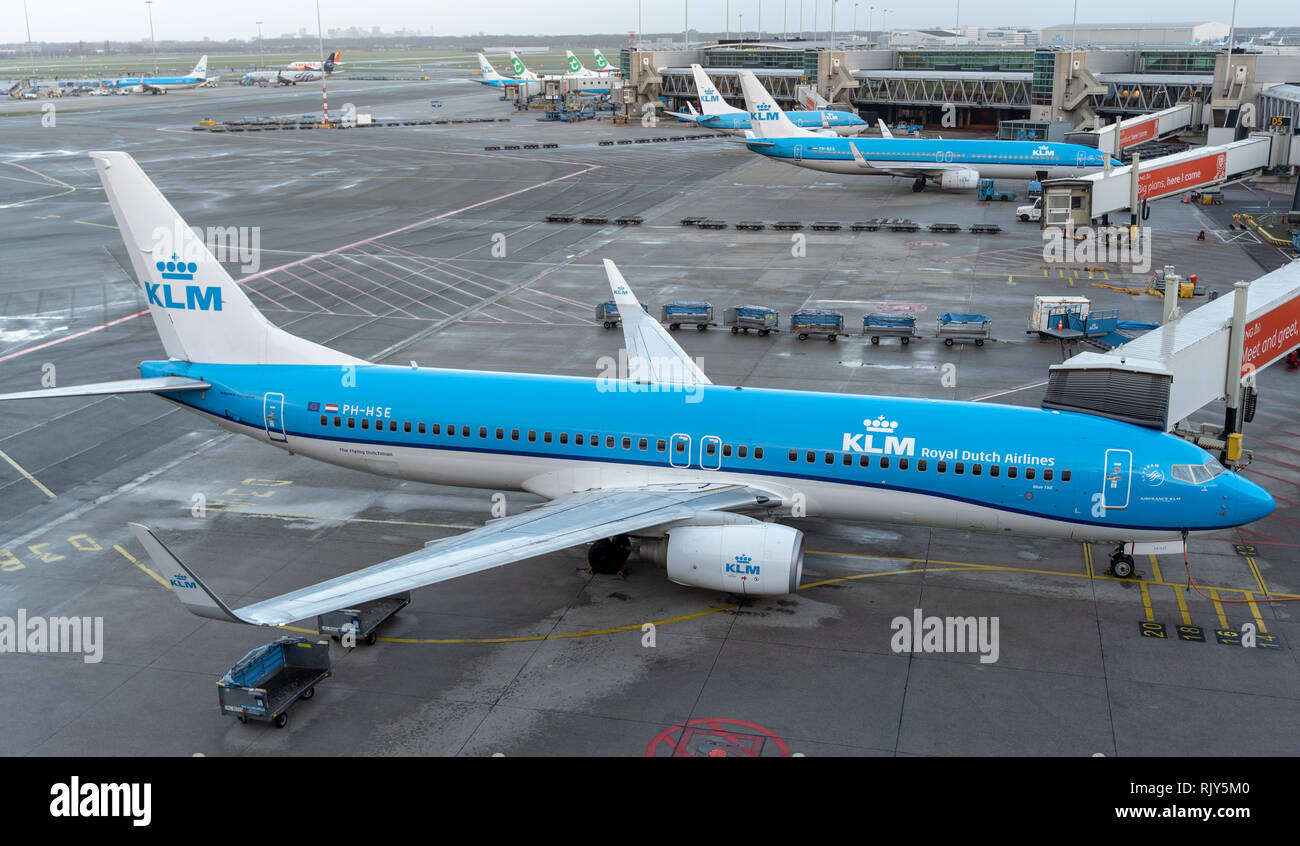 AMSTERDAM / NETHERLANDS - JAN 08, 2019:Planes get ready for a departure in Amsterdam airport Schipol Stock Photo