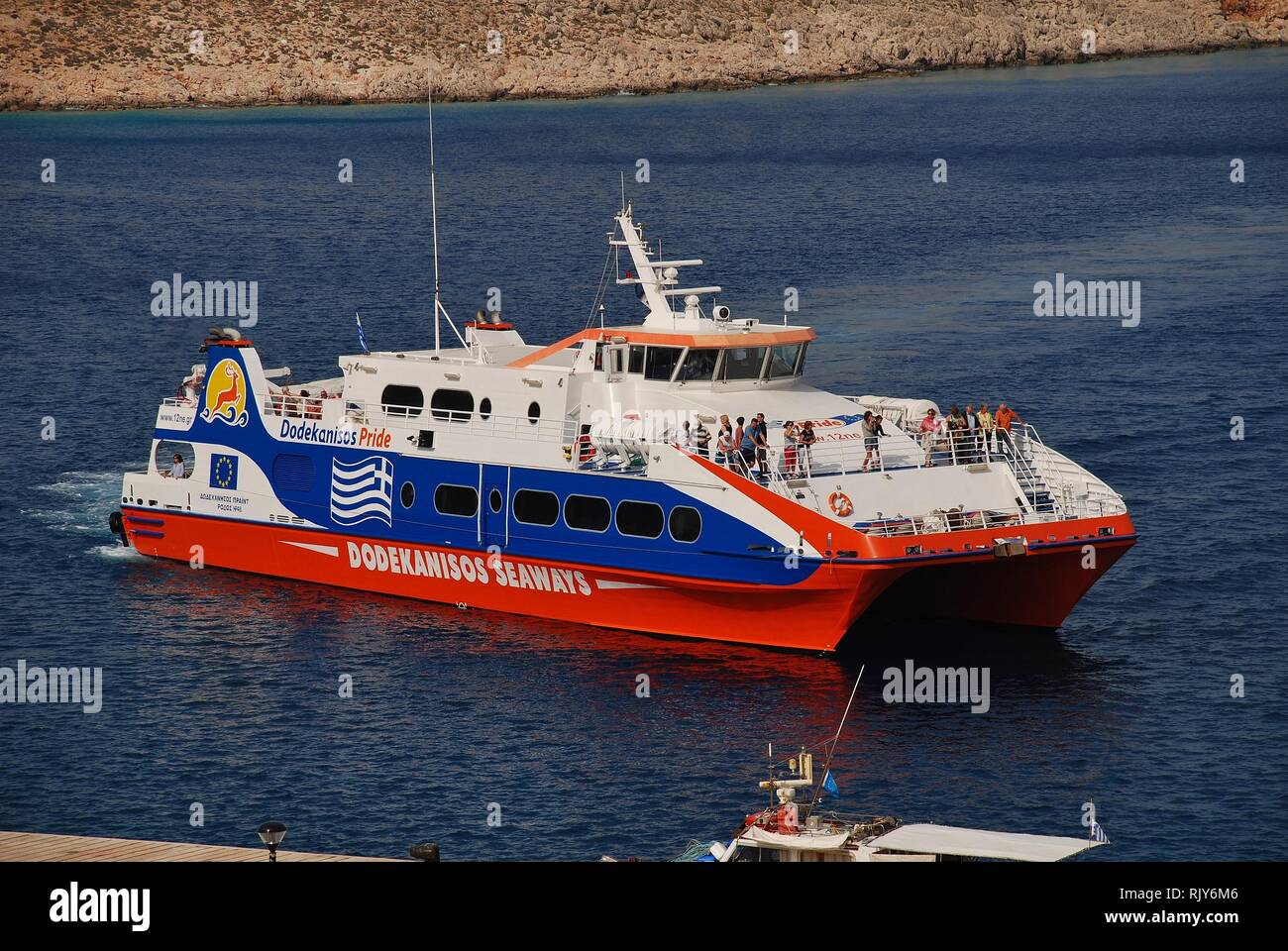 Dodekanisos Seaways catamaran ferry boat Dodekanisos Pride arrives at Emborio harbour on the Greek island of Halki on June 8, 2017. Stock Photo