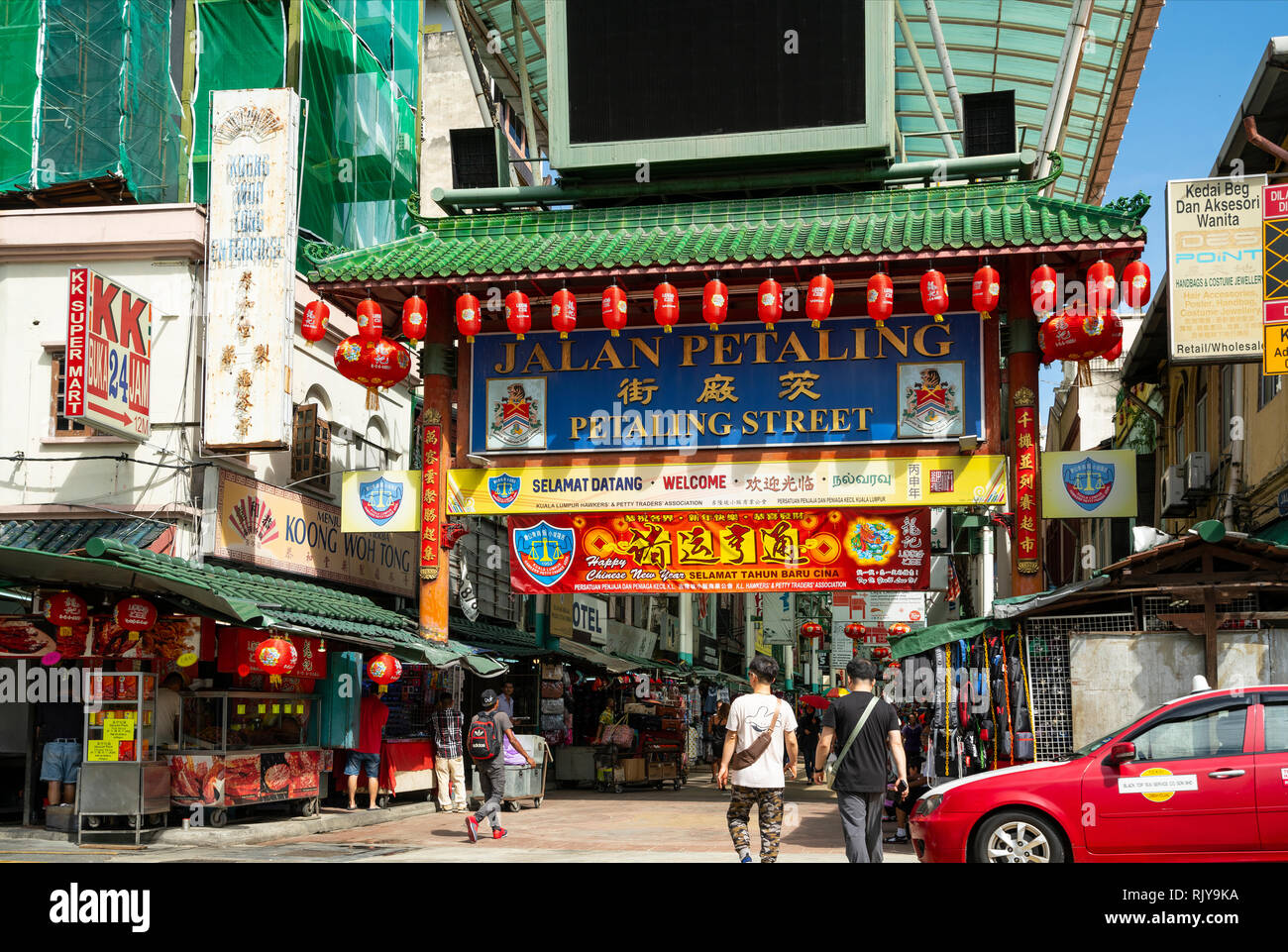 People at the gate of Petaling street market at Chinatown in Kuala Lumpur, Malaysia Stock Photo
