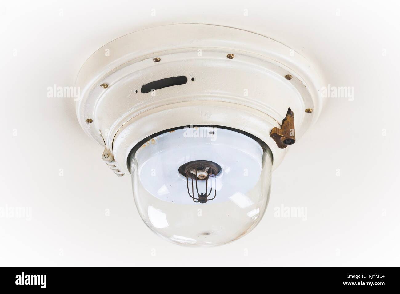 Old white ceiling lamp in a historical railroad car Stock Photo