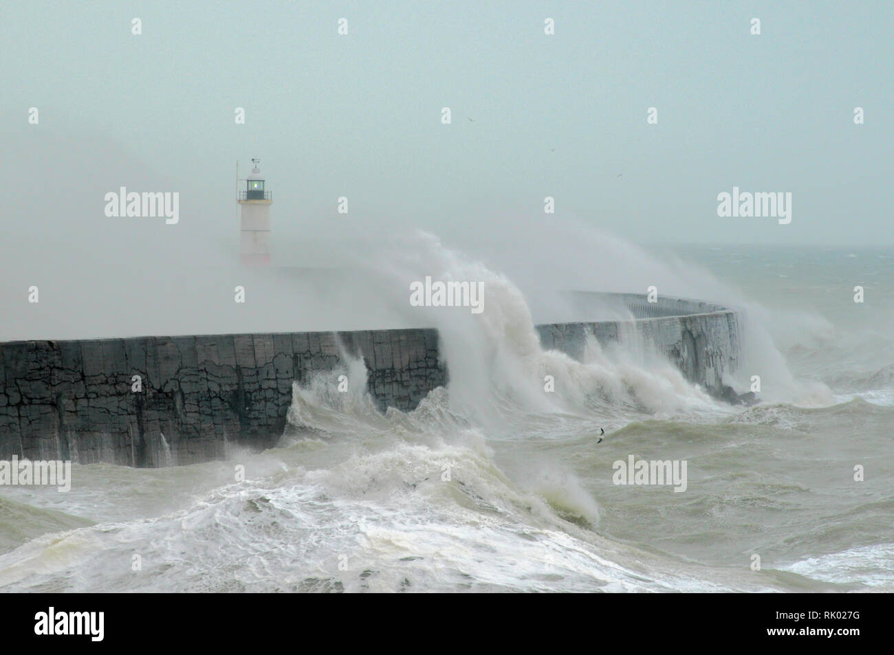 Newhaven, East Sussex, UK..8 February 2019. Storm Erik brings gale force winds whipping up the surf & creating big waves along the South coast. . Stock Photo