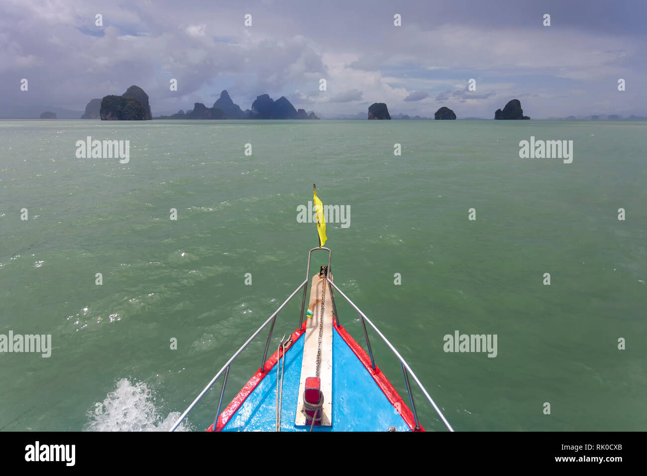 Thai boat and limestone islands Stock Photo