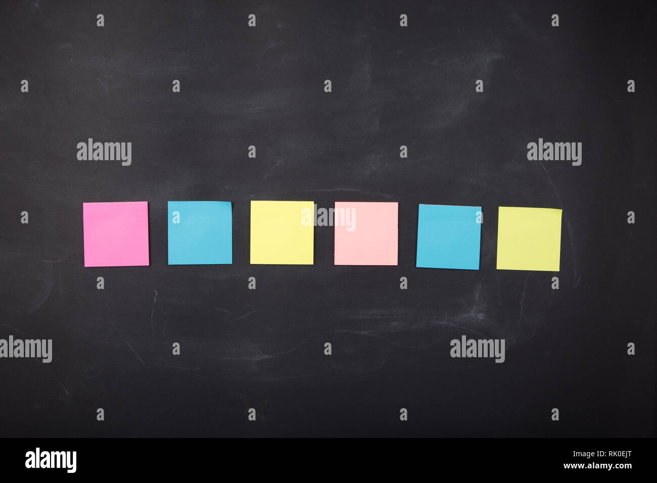 Colorful sticky notes on the blank blackboard Stock Photo