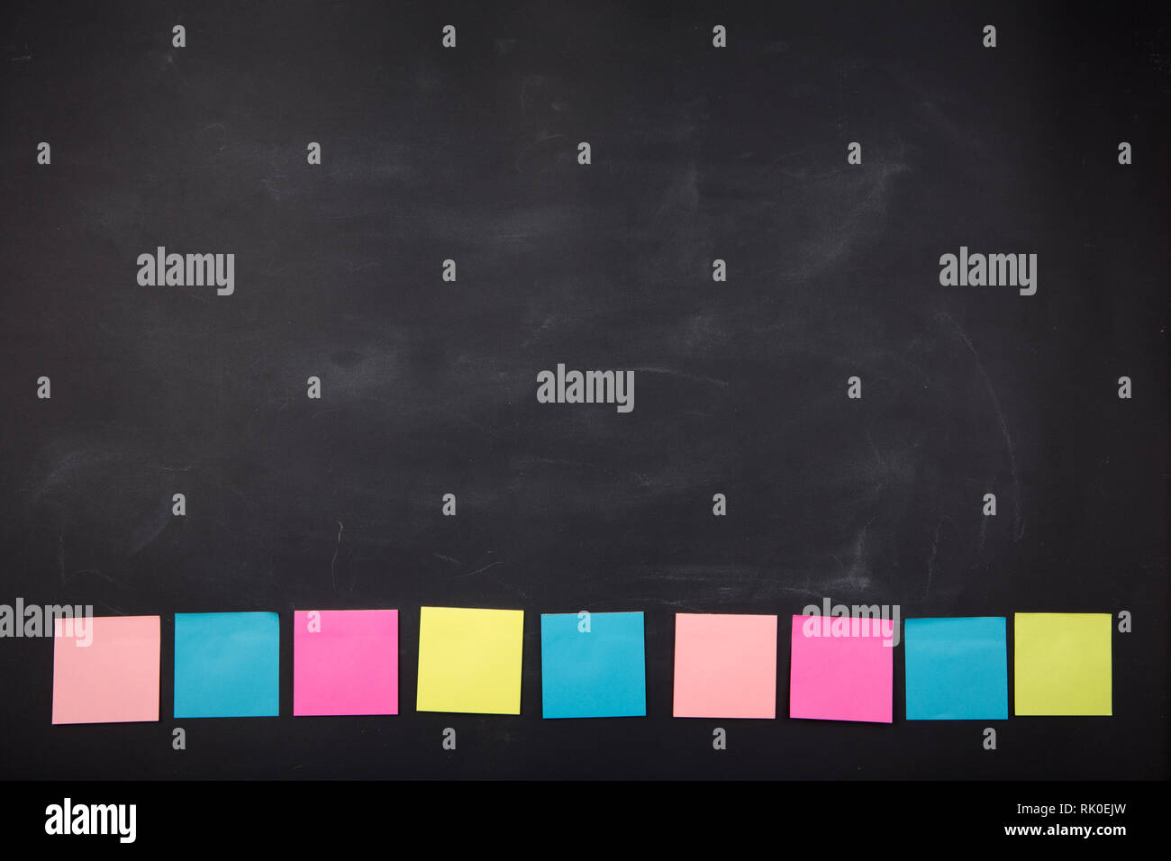 Colorful sticky notes on the blank blackboard Stock Photo